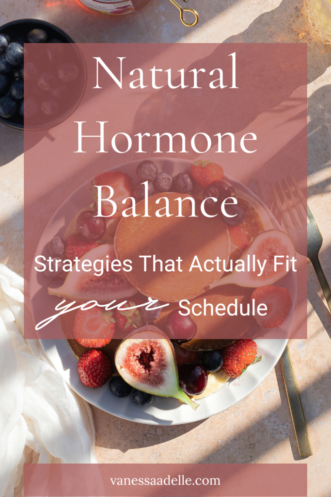 An image of a healthy plant-based breakfast bowl with berries and figs with a text overlay that reads Natural Hormone Balance Strategies That Actually Fit Your Schedule